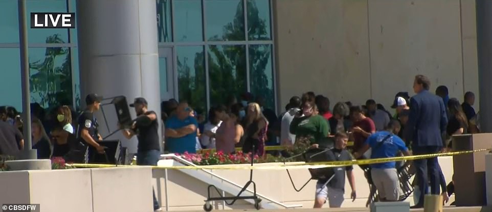 The image above shows students at the family reunification center where they met parents after the shooting