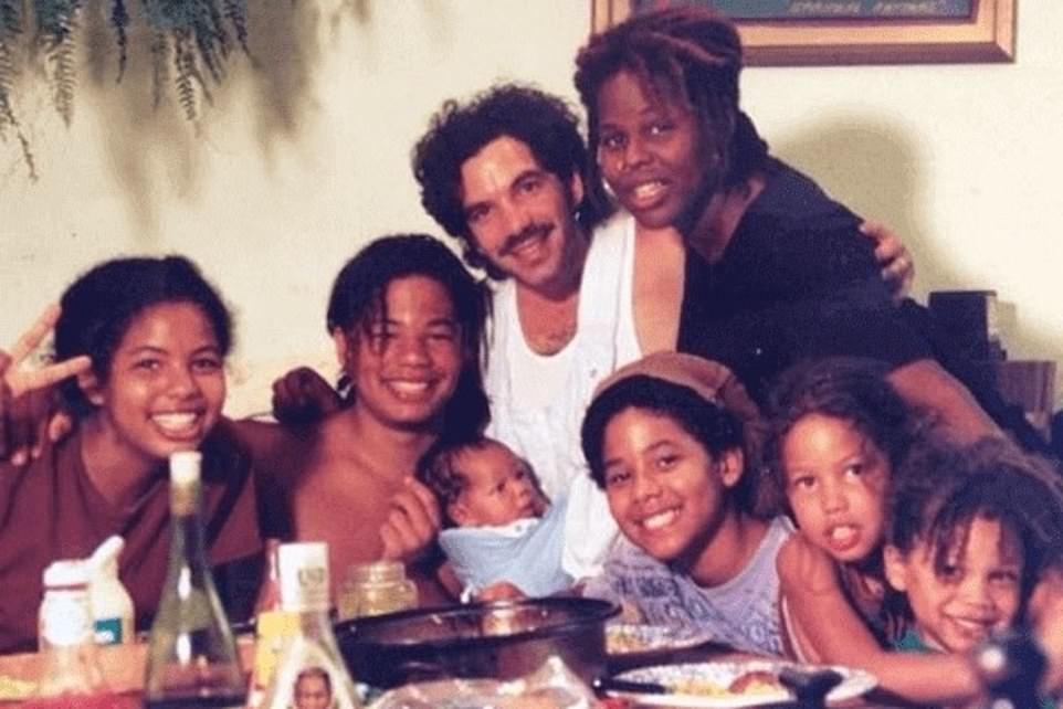 Smollett showed a photo of his family growing up and spoke about his family background earlier on direct examination. He said he didn't get along with his father (pictured center) growing up but they made peace before he died in 2015